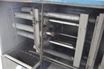 Tube reducing machine