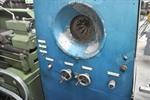 Tube reducing machine