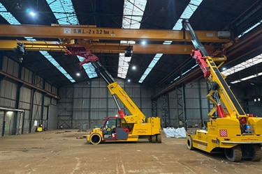 SWF overhead crane with rotating hoist beam with 2 hoists.